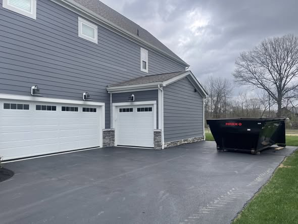 Redline Hauling roll-off dumpster on Powell Ohio residential driveway delivery