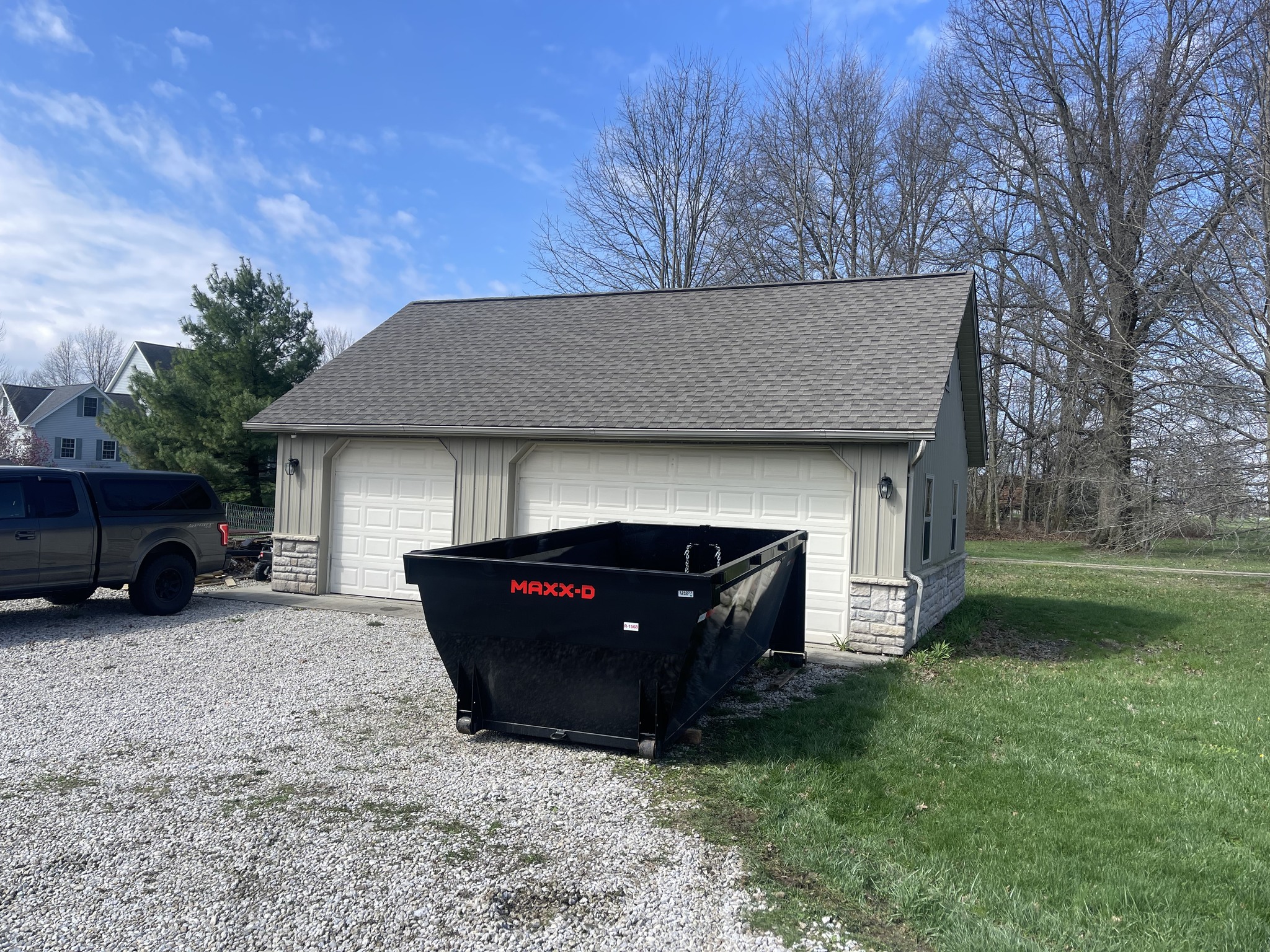 Redline Hauling roll-off dumpster on Lewis Center Ohio residential driveway delivery