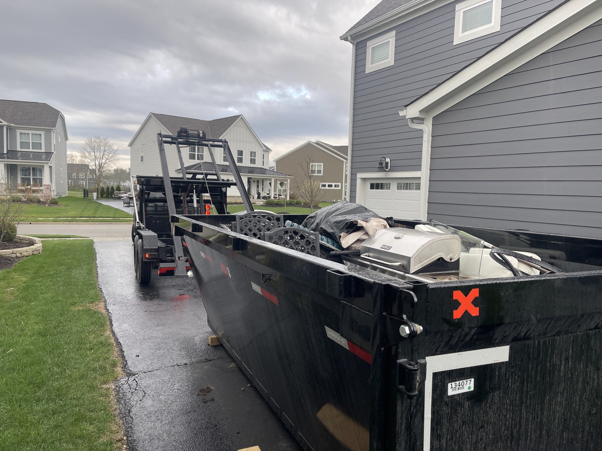 Redline Hauling 20 yard roll-off dumpster on Sunbury Ohio construction job site
